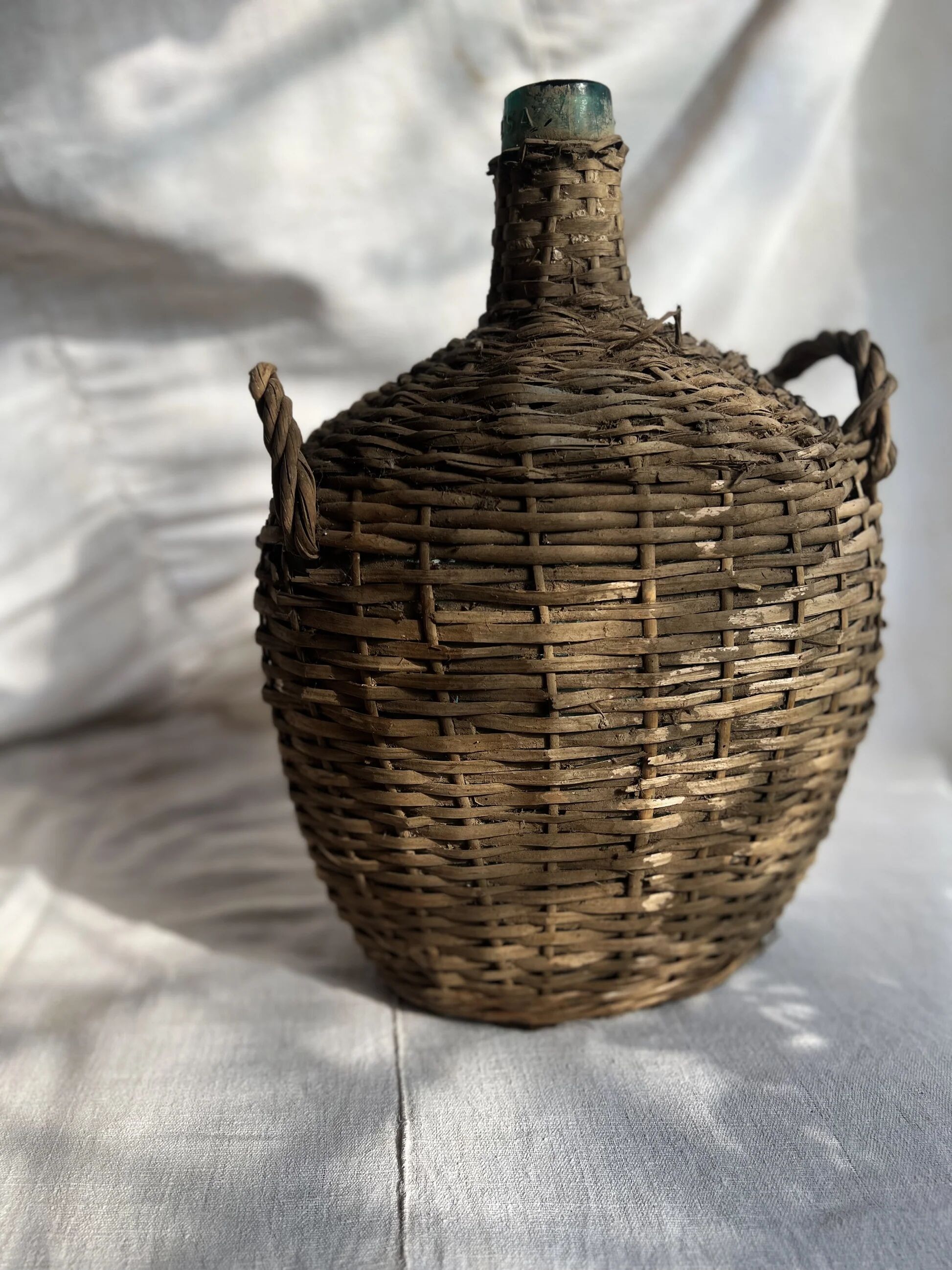 Vintage Spanish wicker demijohn bottle