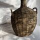 Vintage Spanish wicker demijohn bottle