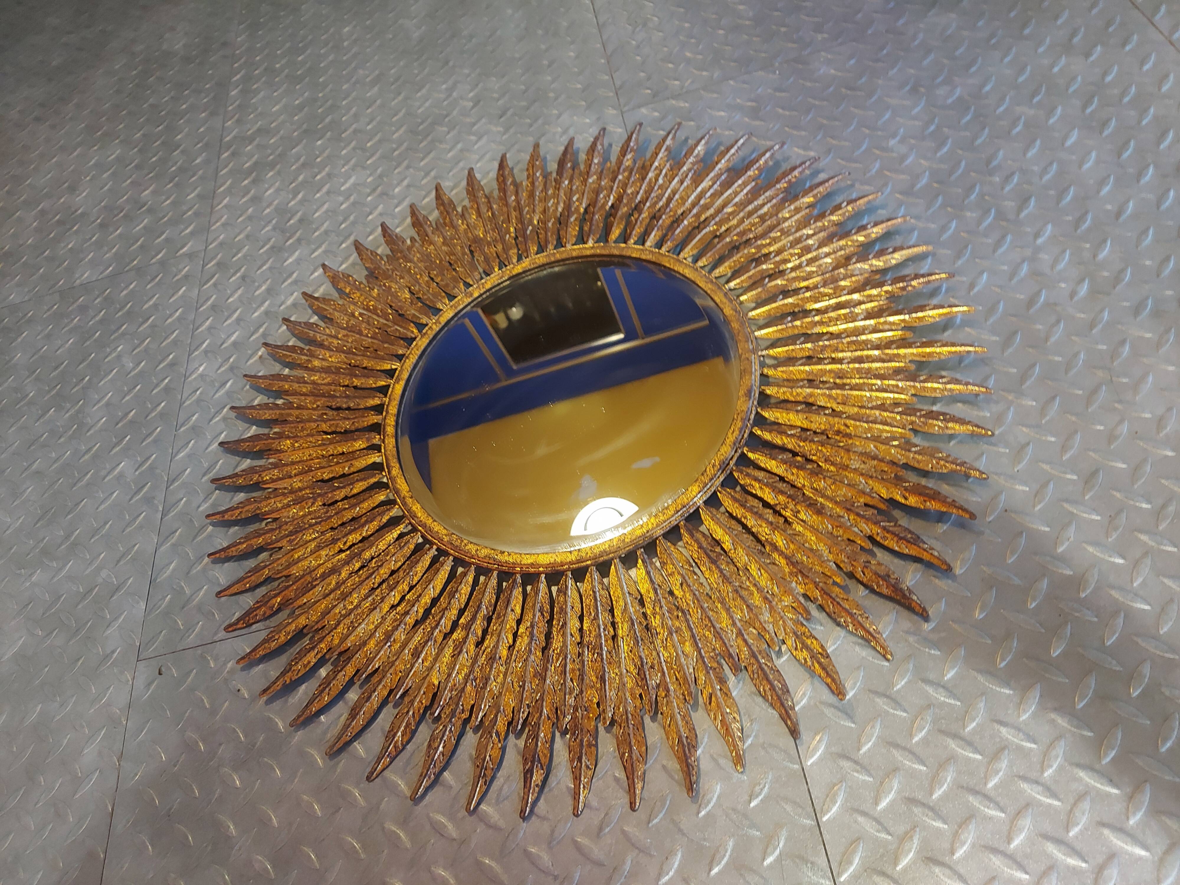 Miroir soleil en métal doré 62cm