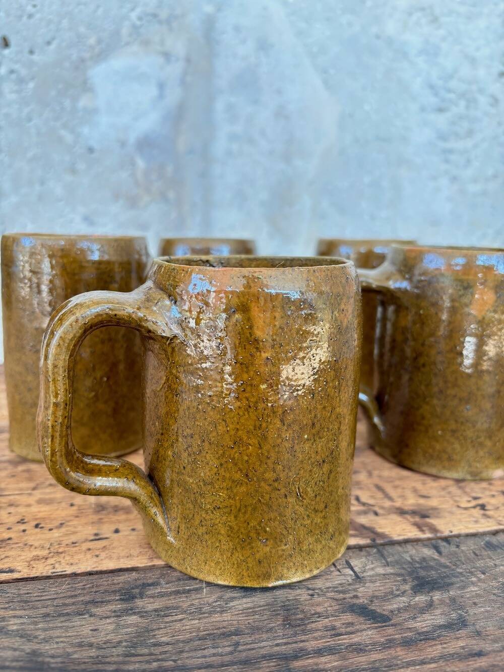 Set of 5 brown stoneware mugs