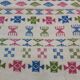 White carpet with Berber motifs pink green and blue