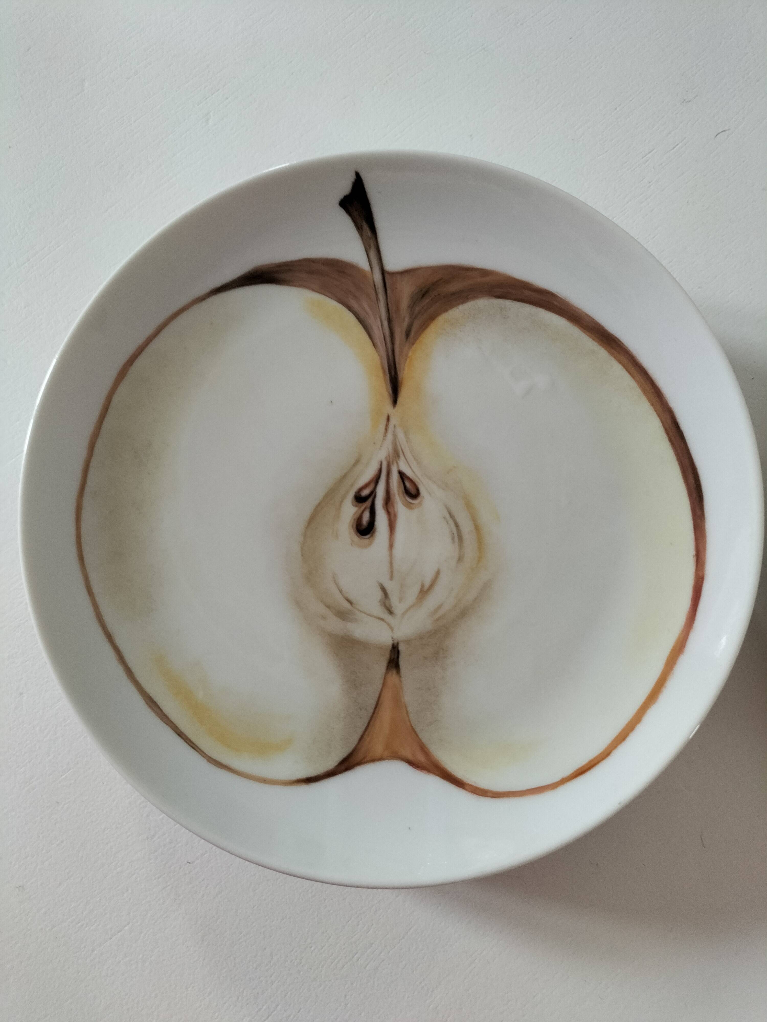 5 hand-painted dessert plates with stylised fruit designs.