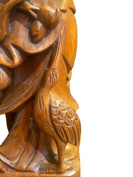 Carved wooden table lamp representing a man