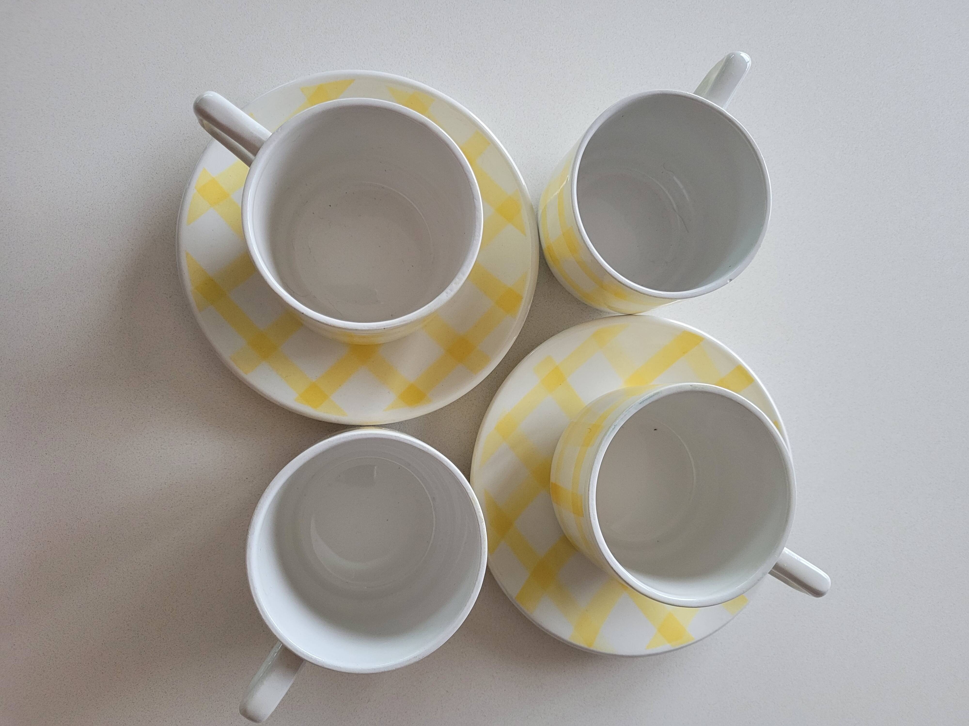 4 cups, 2 under cups yellow and white tea towel pattern