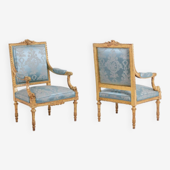 Pair of Louis XVI style armchairs in gilded and carved wood. Circa 1880.