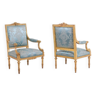 Pair of Louis XVI style armchairs in gilded and carved wood. Circa 1880.