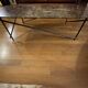 Emperador marble coffee table with bronze legs