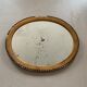 Old oval mirror stitched