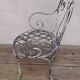 19th-century garden armchair in wrought iron