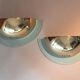 Pair of gold metal and plexiglass wall lights, circa 1980.