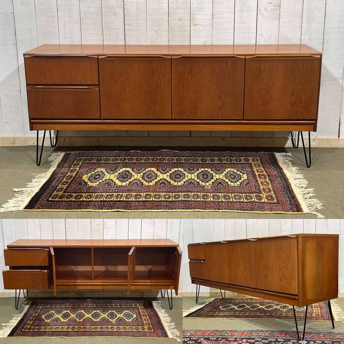 1970s English enfilade in teak with splayed legs.