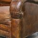 Charming and comfortable vintage armchair in grained cowhide leather with character