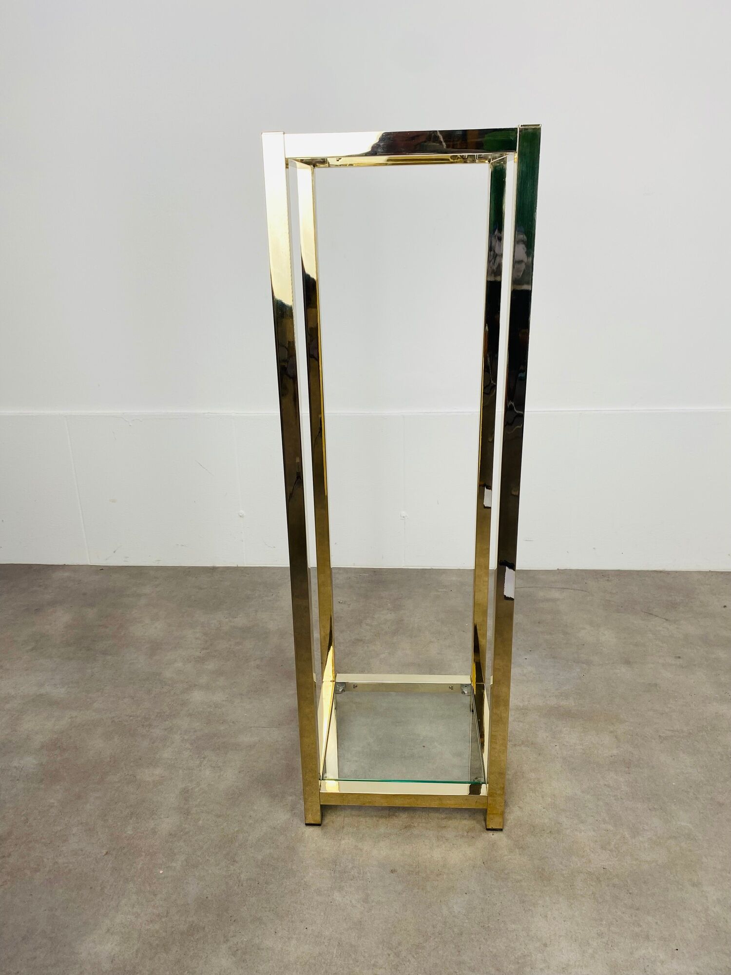 Gilded metal fifth wheel column and Hollywood Regency style glass 70s