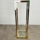 Gilded metal fifth wheel column and Hollywood Regency style glass 70s