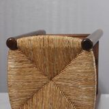 Vintage straw stool in the style of Charlotte Perriand, 1970s.