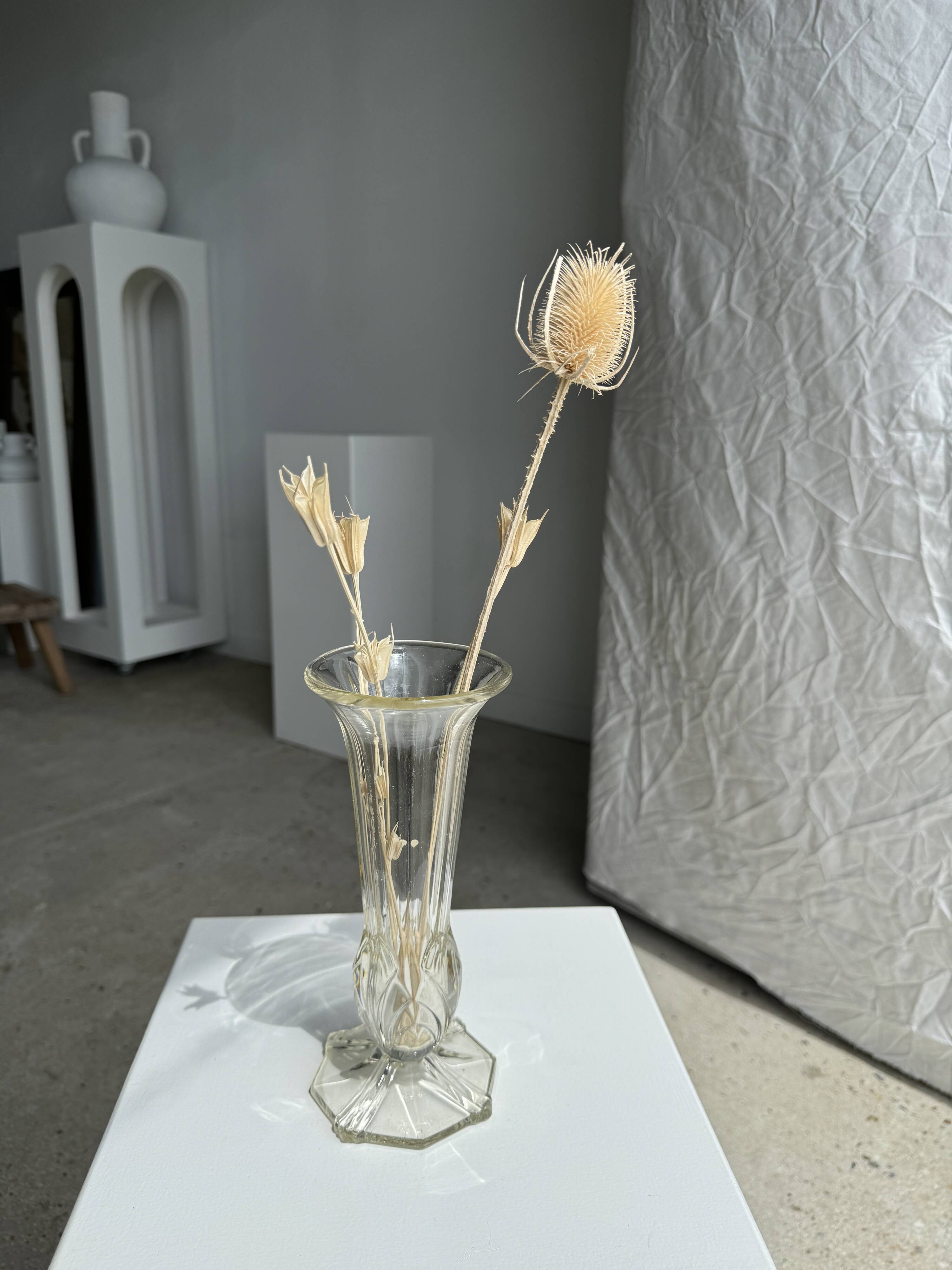Art deco style flared neck pedestal vase in blown glass