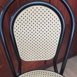 Chair in natural rattan and black metal