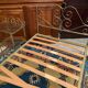 Romantic style single bed in brass with bedside table