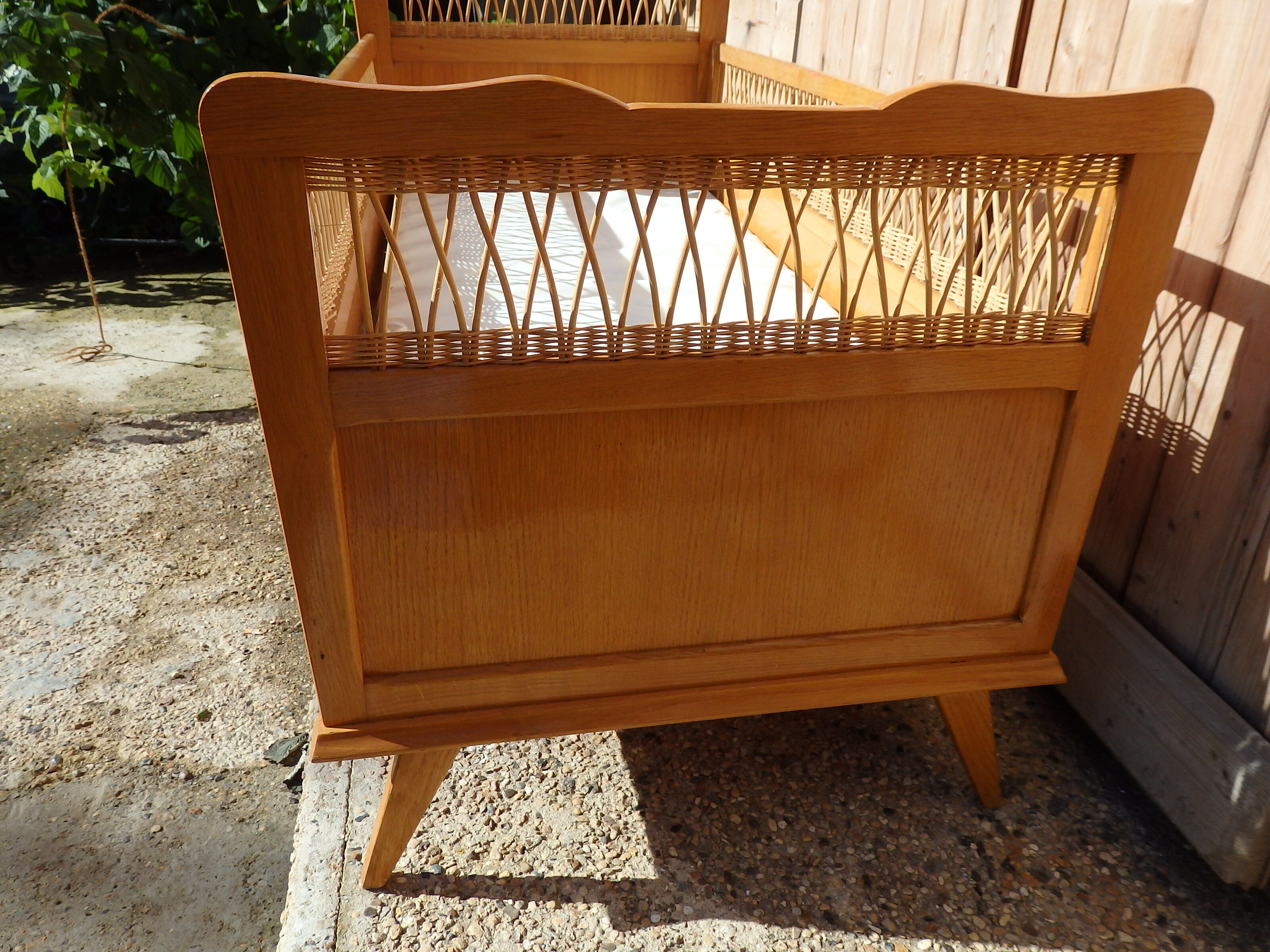 Vintage baby bed in rattan