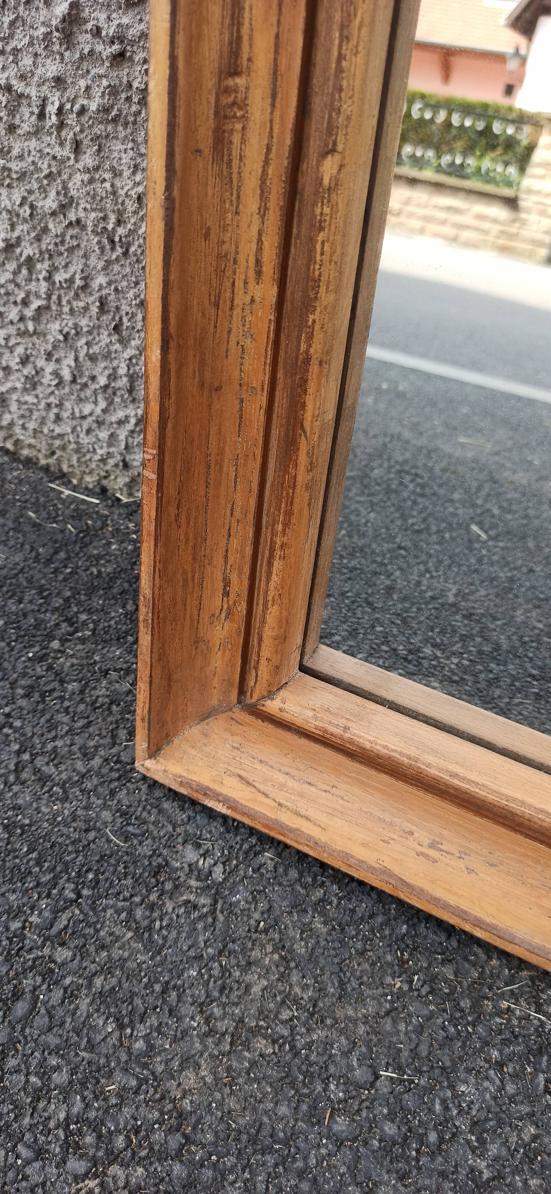 Square mirror in old wood