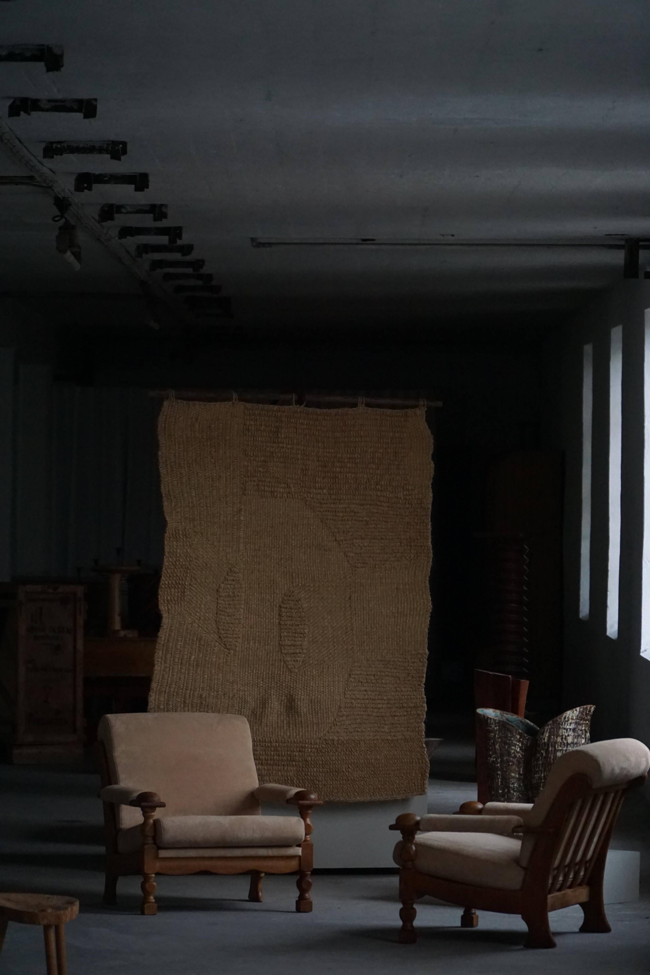 Mid-20th century, pair of armchairs by Henning Kjærnulf, oak and alcantara, 1960s.