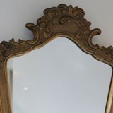 Old mirror gilded wooden frame and polychrome décor.