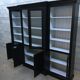 Black patinated wooden bookcase