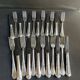 12 Forks and 12 cheese or dessert knives – Orfèvrerie Perrin Paris