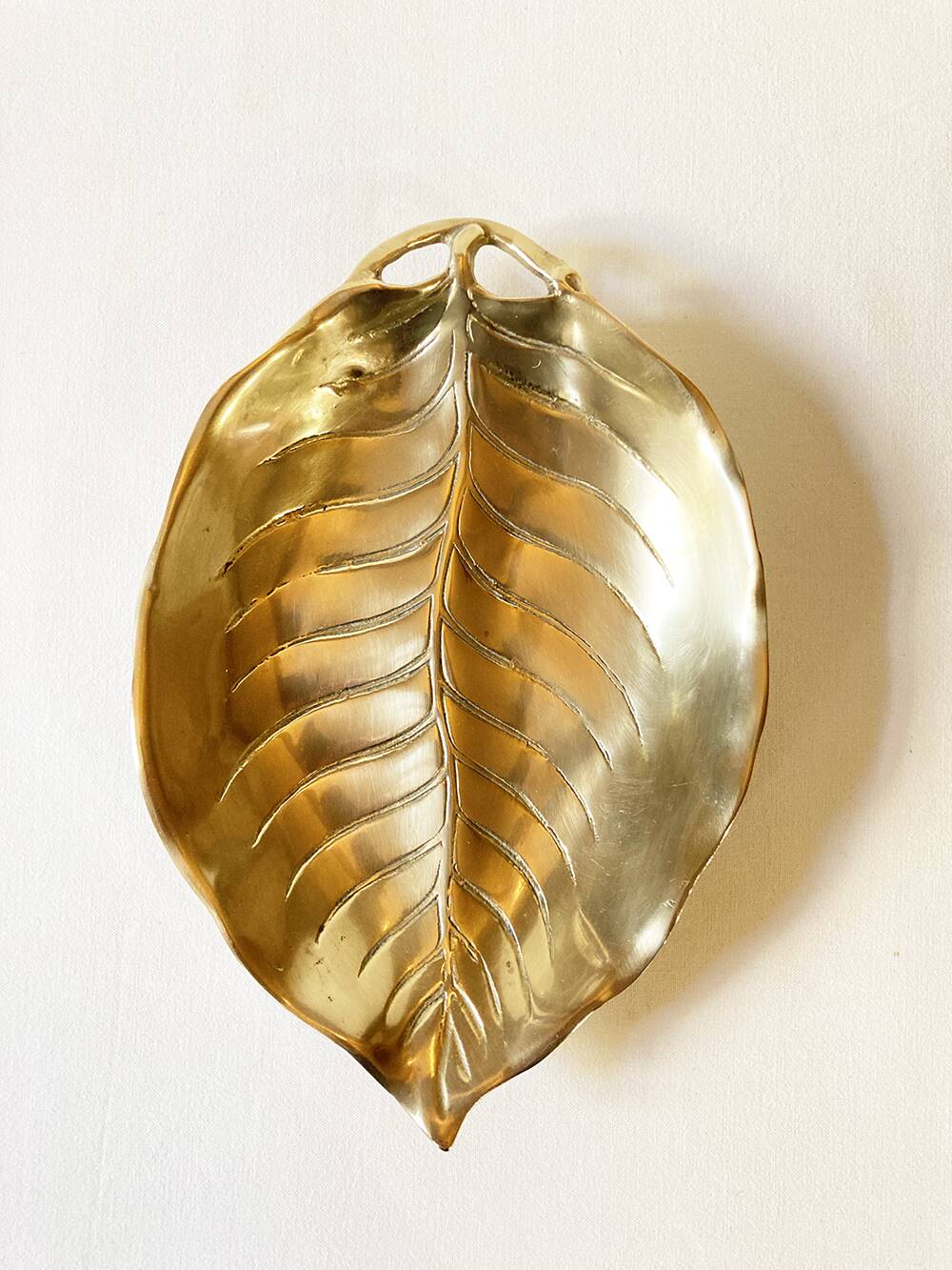 Brass pocket emptier