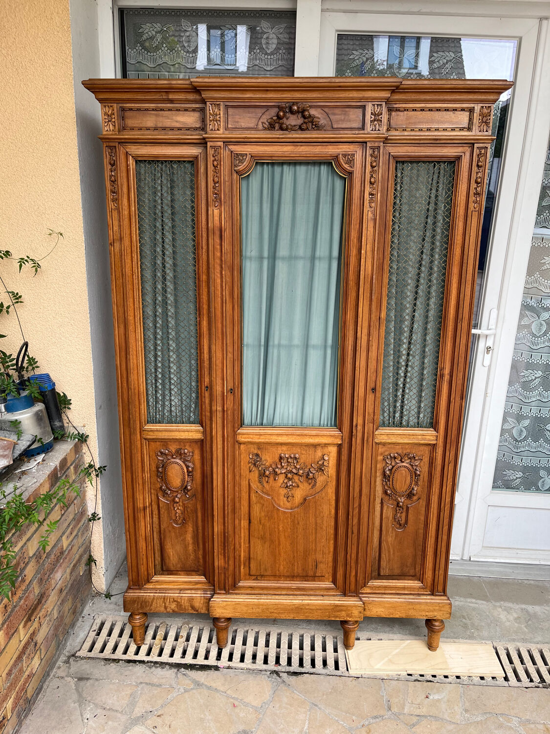 Antique carved wooden bookcase