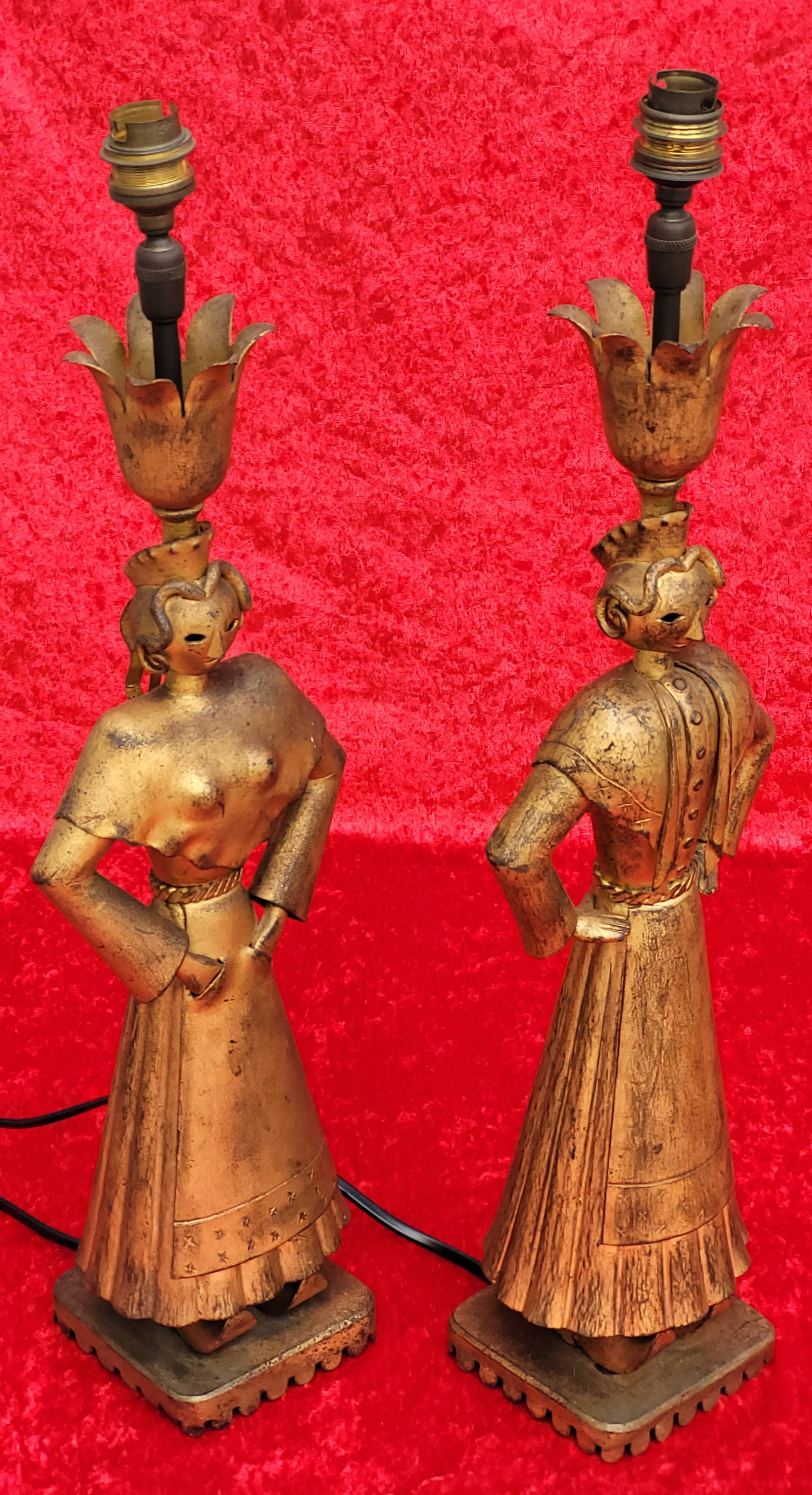 Pair of gilded beaten iron sculpture lamps attributed to Gilbert Poillerat