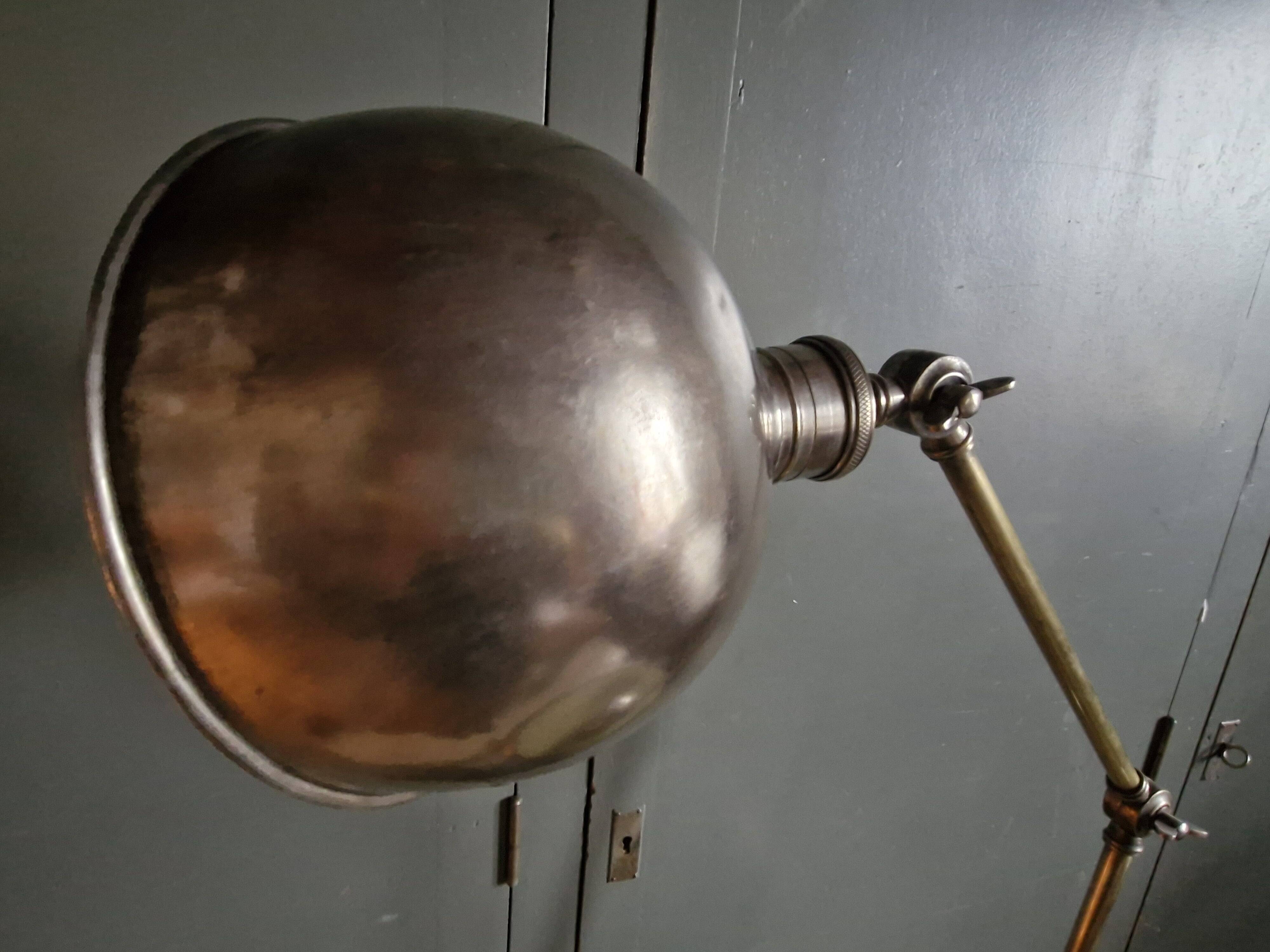 Old adjustable industrial lamp in bronze with 2 arms.