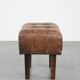 Beautiful sheepskin ottoman on high legs and beautiful warm colours