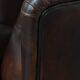 Fauteuil à oreilles de style anglais en cuir de vachette