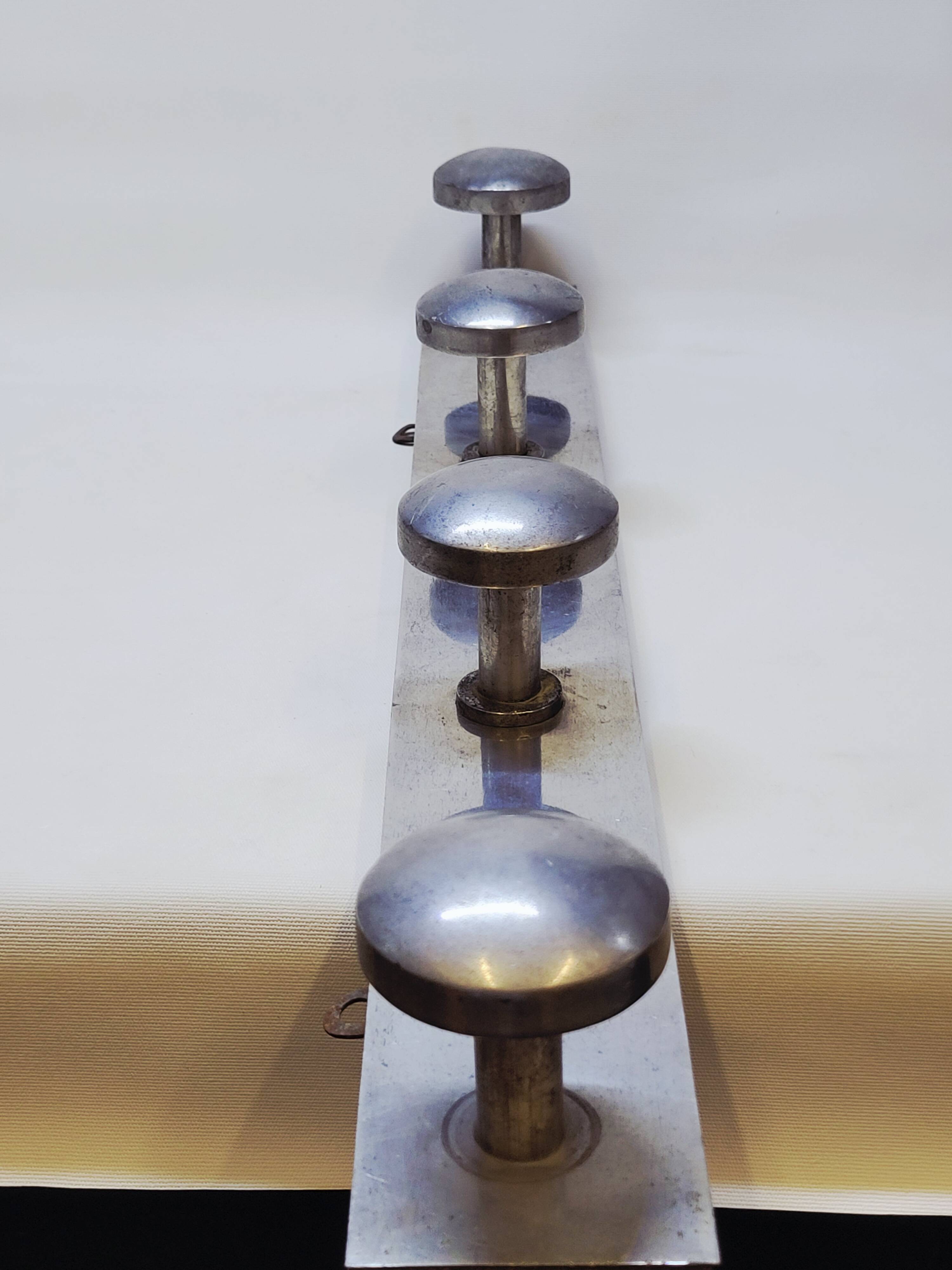 Retro vintage coat rack with 4 aluminum hooks on a wooden frame