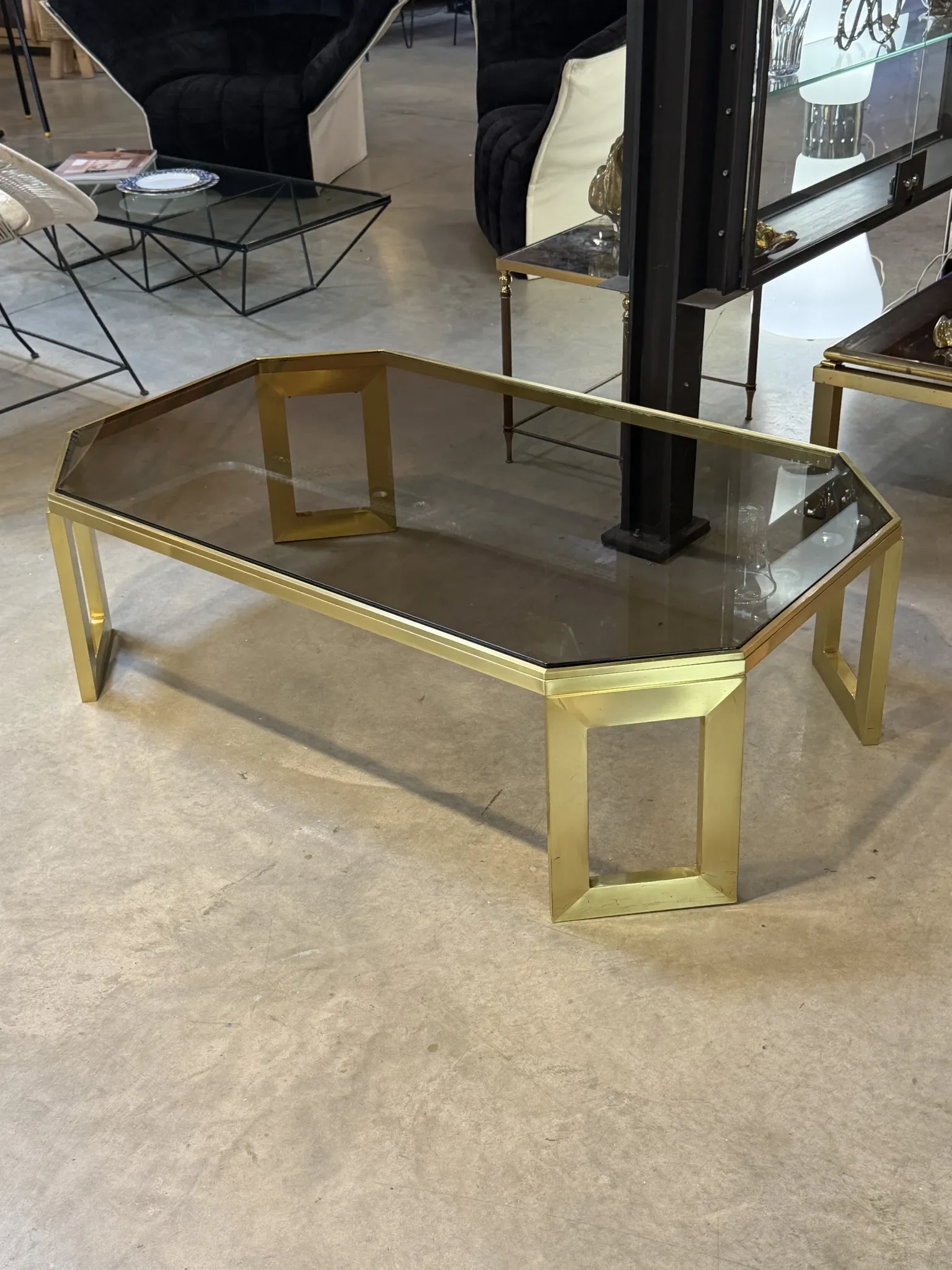 Octagonal brass coffee table, signed Anna Nora.