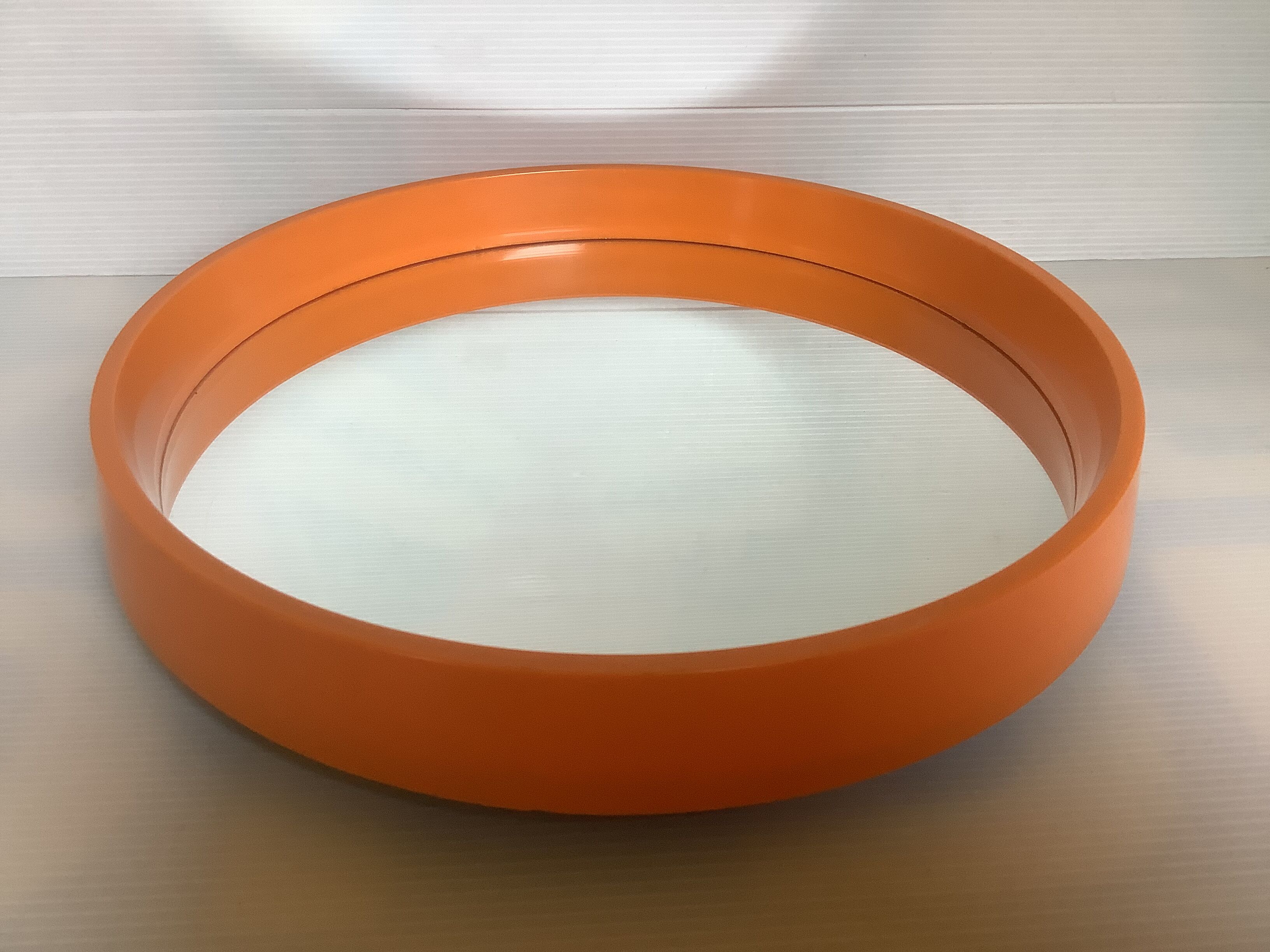 Old vintage orange round mirror