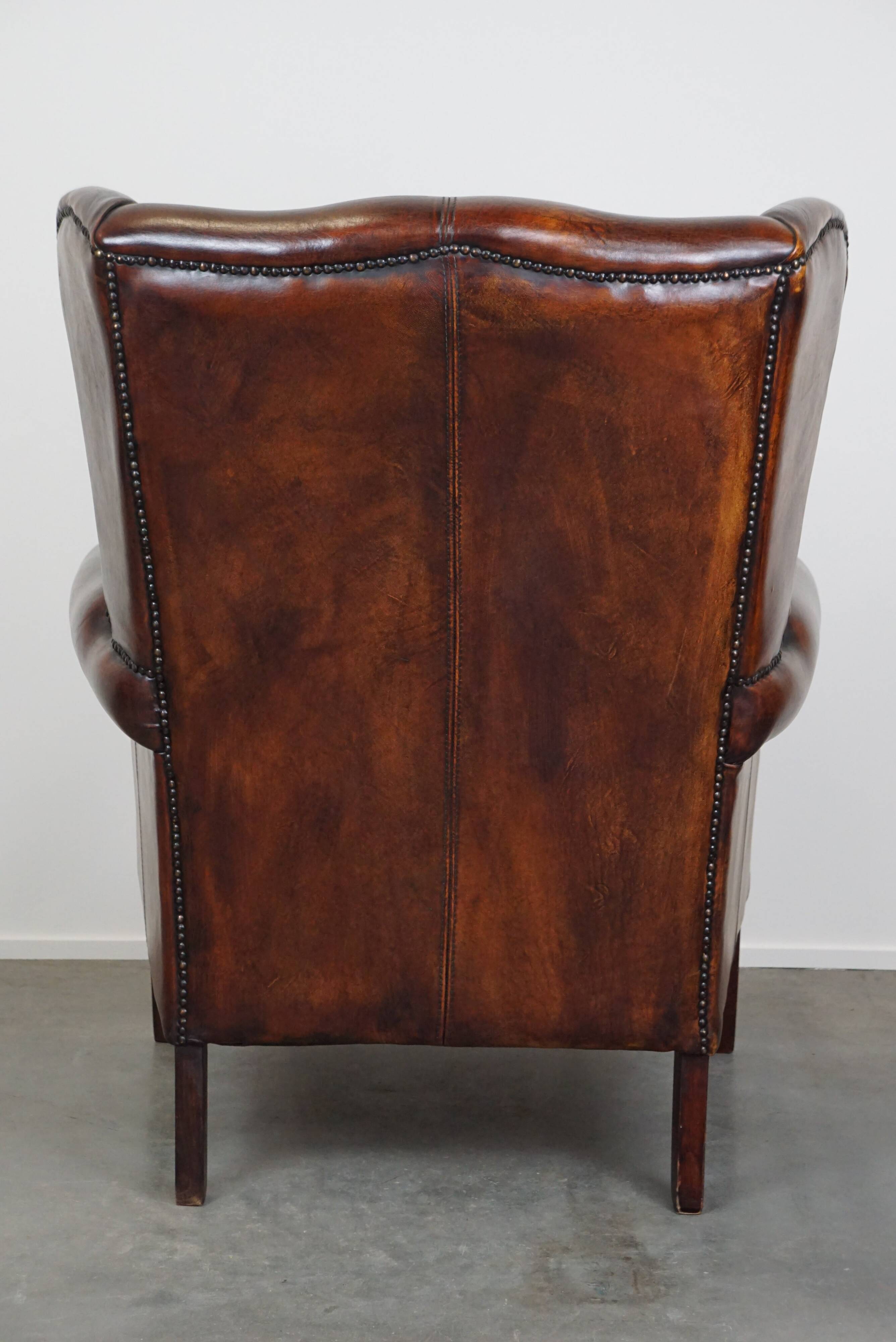 Large Sheepskin Leather Wingback Armchair with a Fixed Seat Cushion and a Stunning Patina