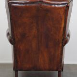 Large Sheepskin Leather Wingback Armchair with a Fixed Seat Cushion and a Stunning Patina