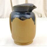 Vintage art deco water pitcher with drippy dark blue glaze.