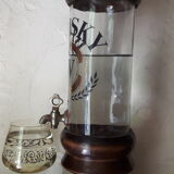 Vintage glass and wood whiskey bottle with pouring tap