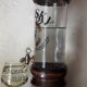 Vintage glass and wood whiskey bottle with pouring tap