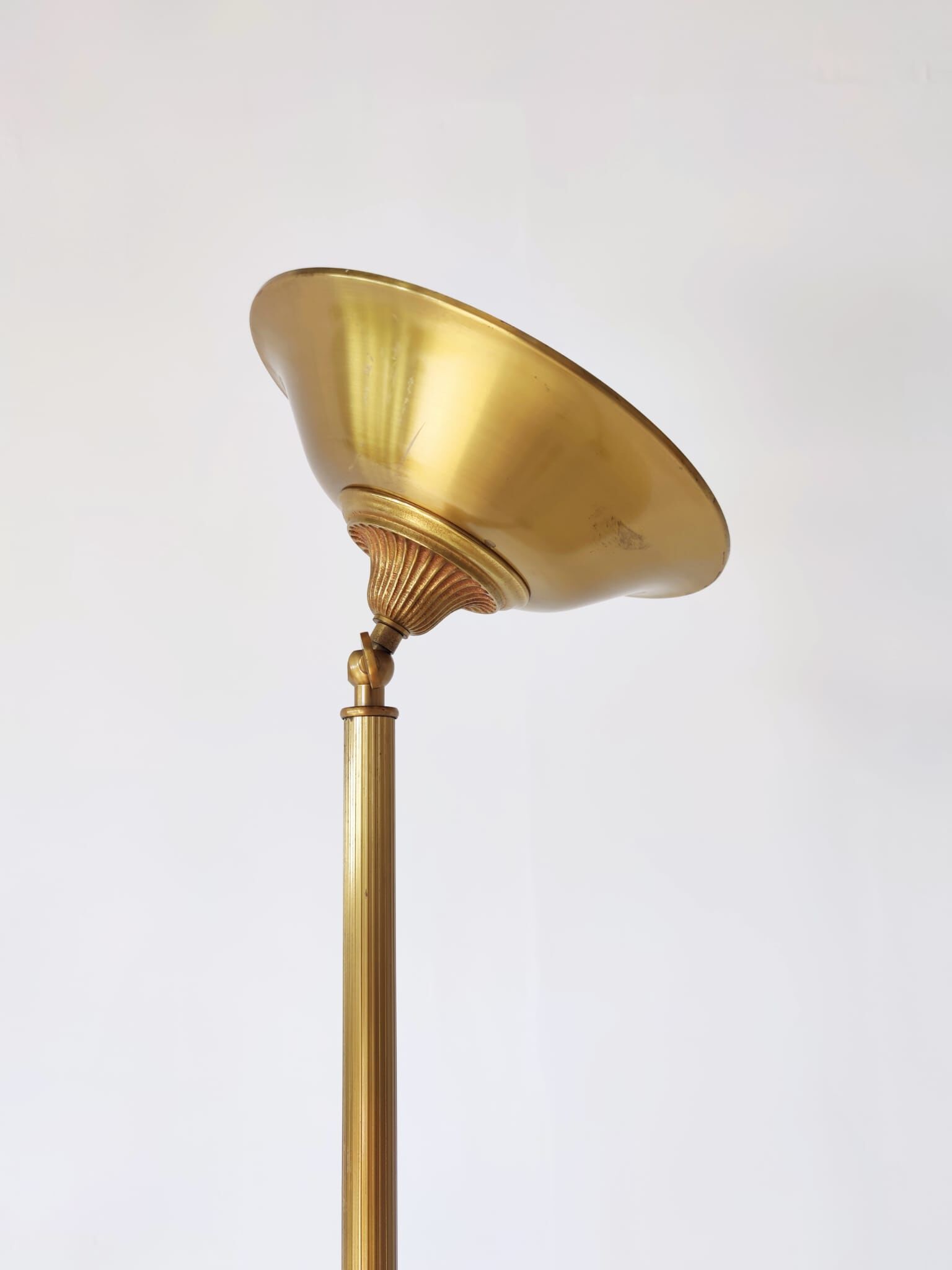 Halogen floor lamp in golden brass