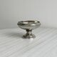 Small silver-plated metal bowl on a stand.