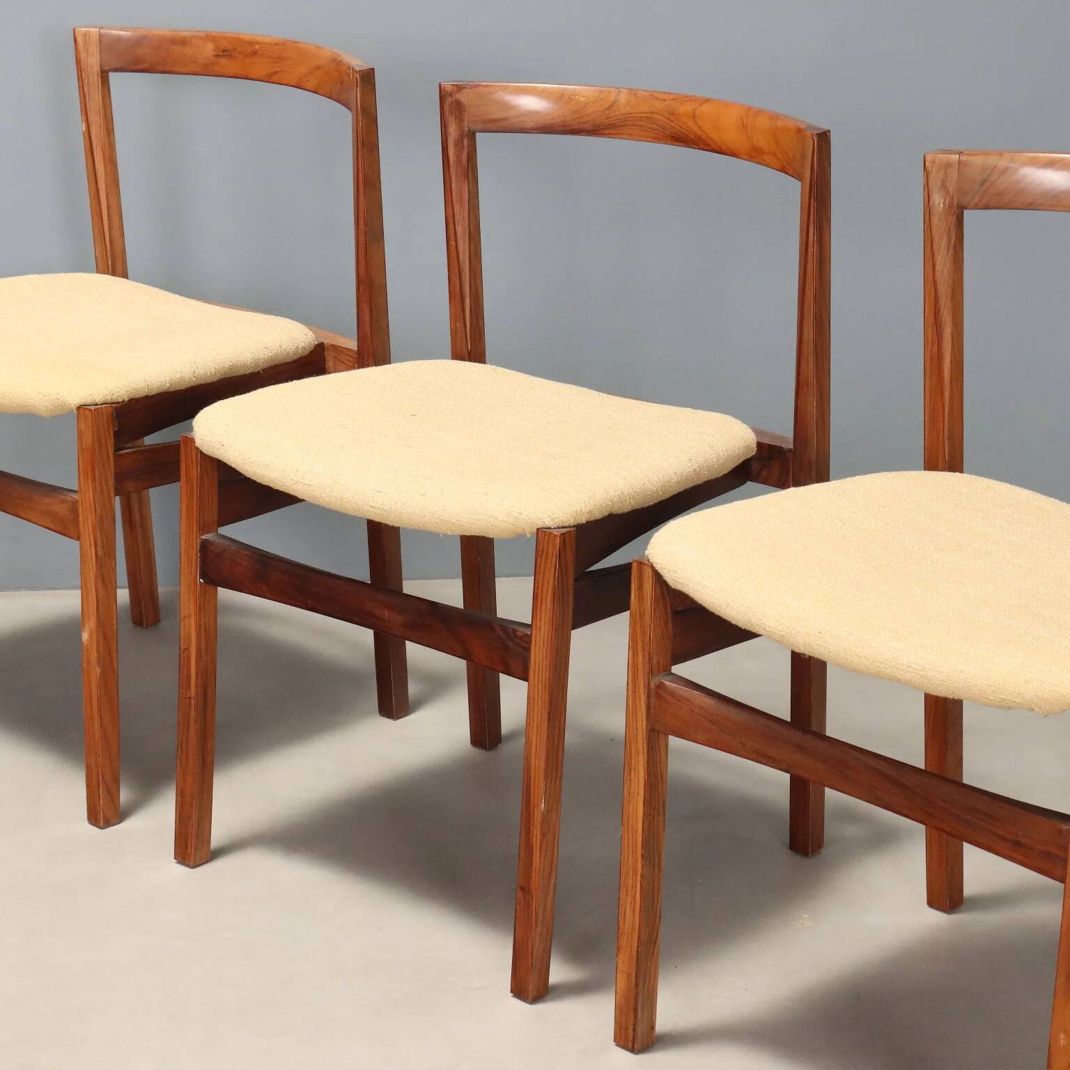 Vintage lounge chairs in exotic wood and fabric, 1960s design.