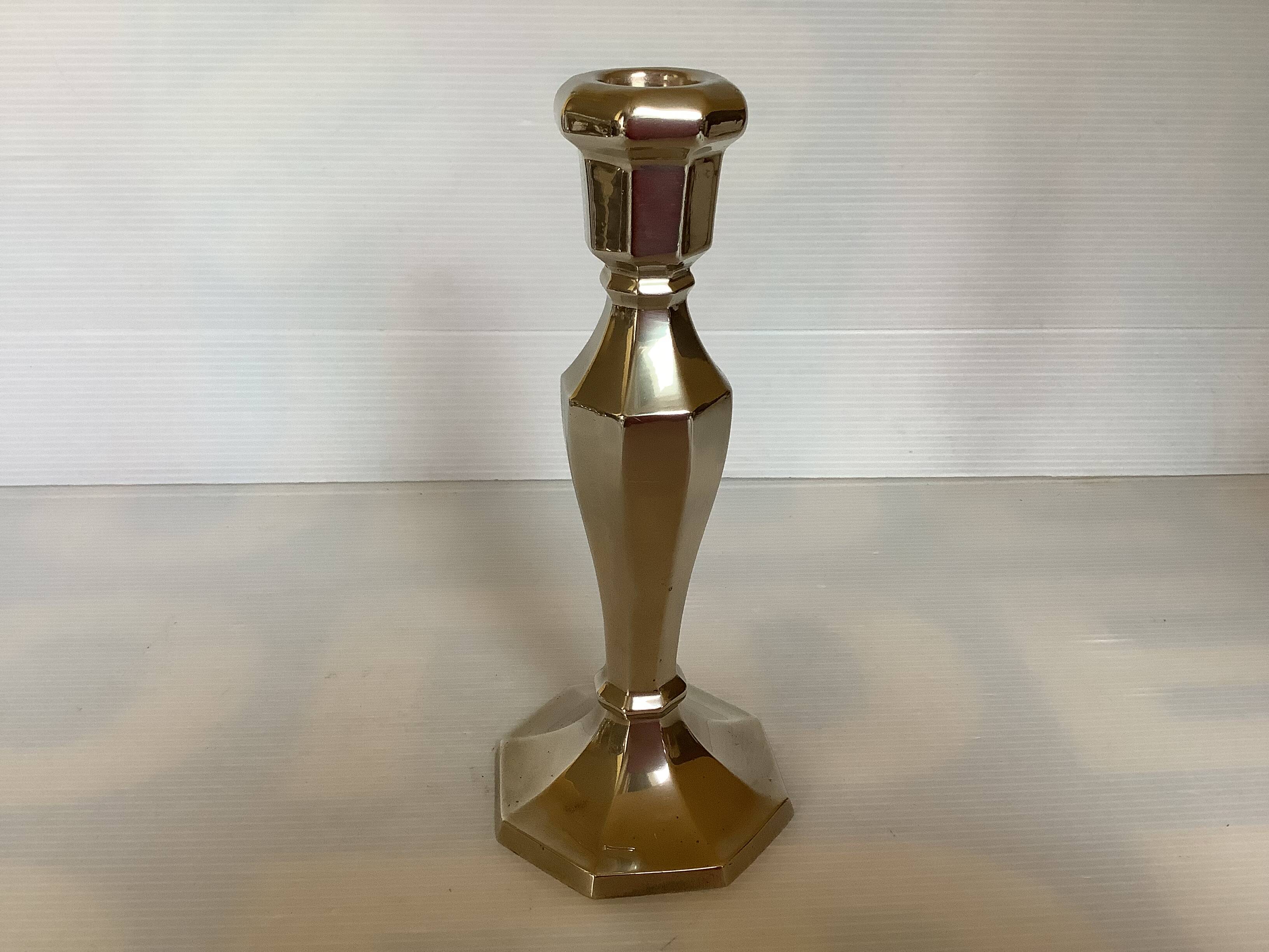 Faceted brass candle holder