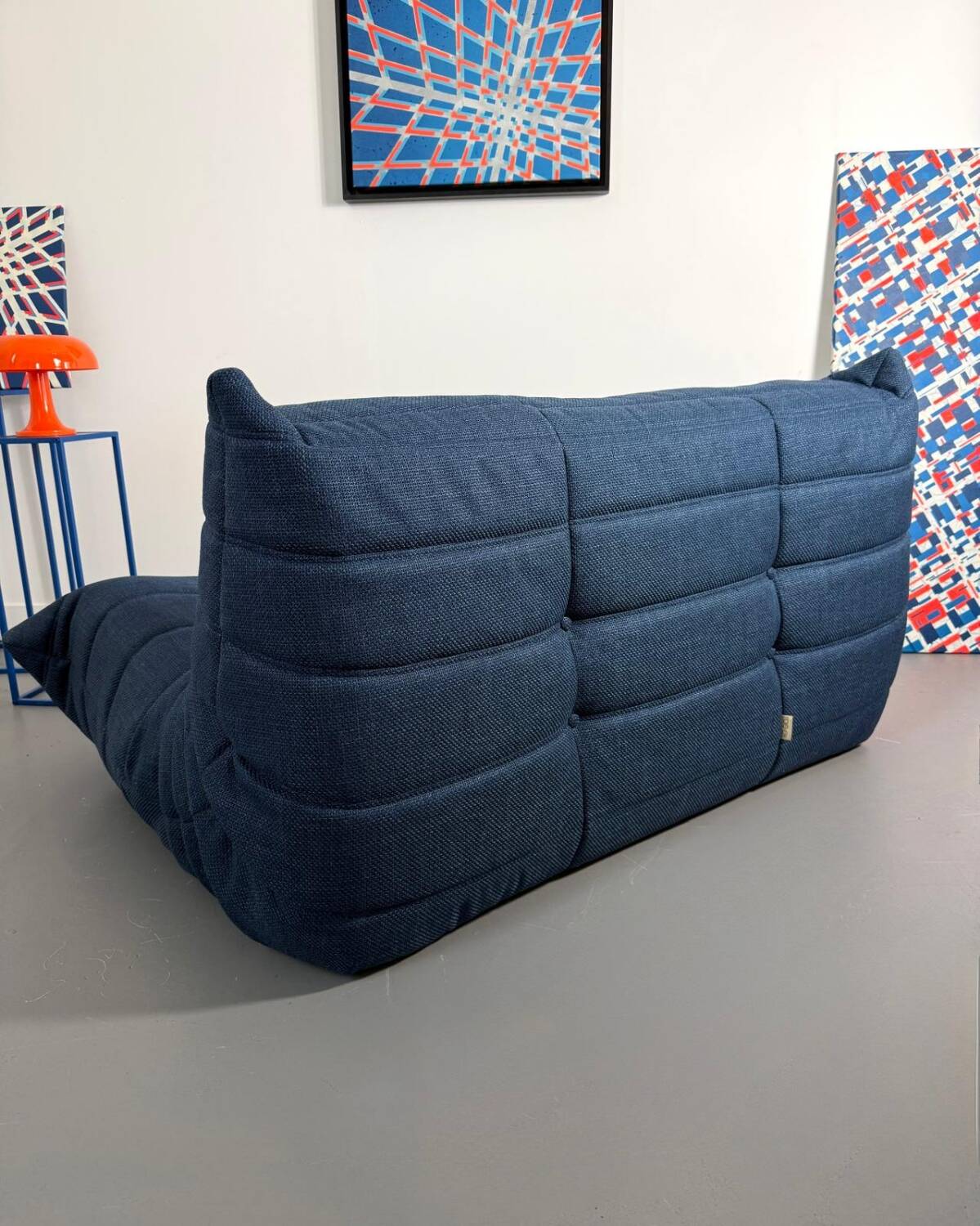 Two-seater sofa reupholstered.