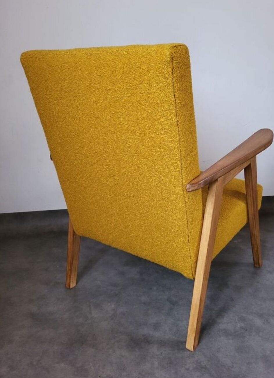 Curly yellow Scandinavian armchair