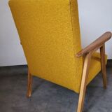 Curly yellow Scandinavian armchair