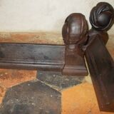 Old cast iron andirons with oriental decor
